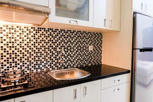 Homey Studio The Oasis Cikarang Apartment By Travelio