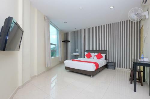 Hostal Oyo 89493 Q Hotel