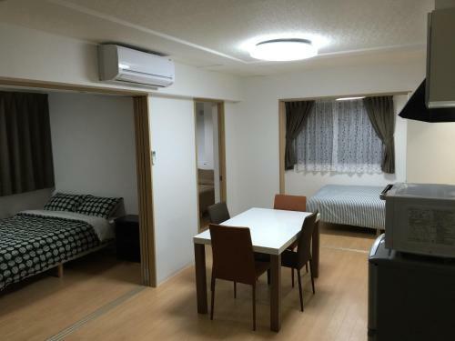 Apartamento Issyuku Hostel