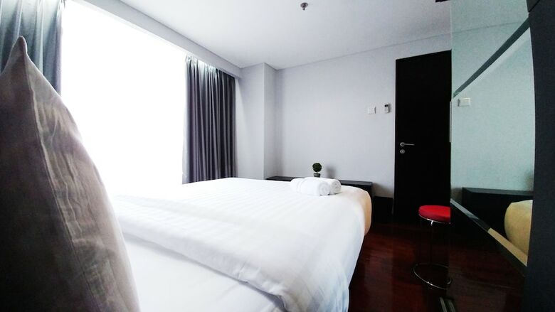 2br Patria Park Apartment By Travelio