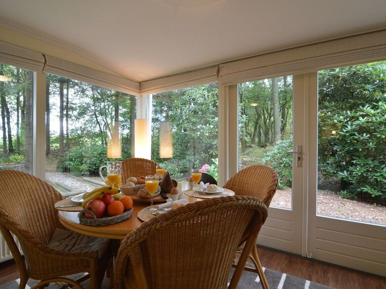 A Detached Bungalow With Outdoor Fireplace, Covered Terrace And Pond In A Forest Plot