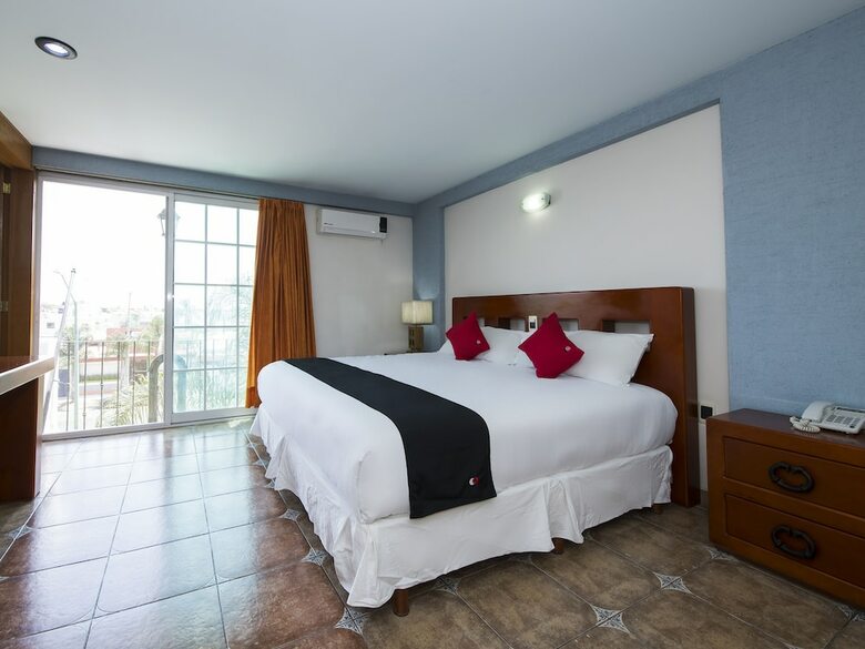 Hotel Capital O Suites de Reyes