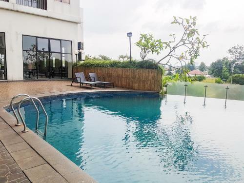 Modern Comfy 2br Serpong Greenview Apartment By Travelio