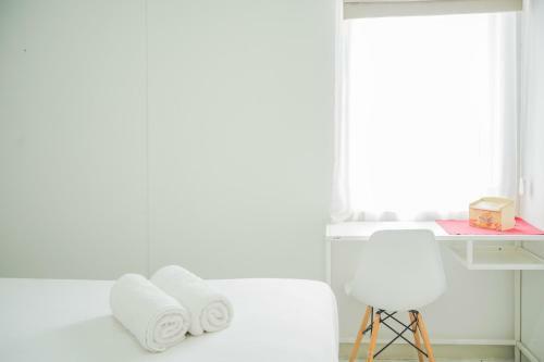 Minimalist 2br At Emerald Bintaro Apartment By Travelio