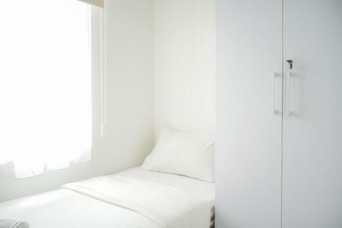 Minimalist 2br At Emerald Bintaro Apartment By Travelio