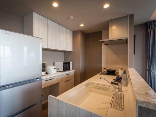 Apartamento Kariyushi Condominium Resort Chatan Route58