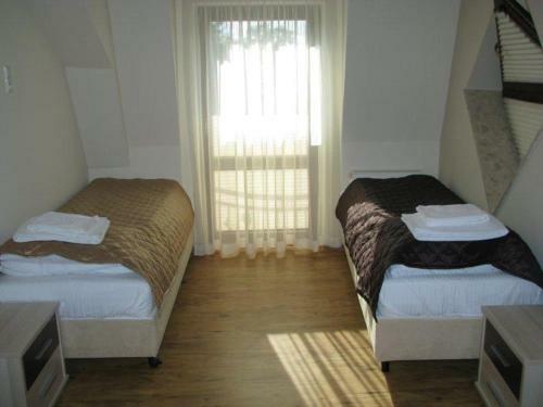 Apartamenty Pod R�?ami