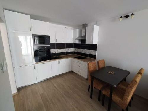 Napsug�r Apartman Ez�stpart