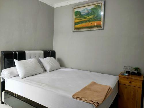 Hotel Express O 91277 Atiq Homestay Syariah