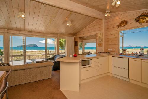 Absolute Beachfront Bach - Pauanui Holiday Home