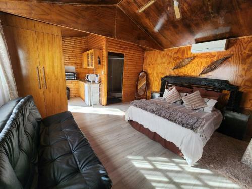 The Log Cabin Apartments Hotel