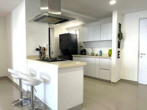 Apartamento Lovely 2-br Oceanfront Condo With Rooftop Pool
